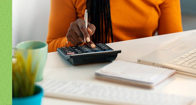 African-American woman looking through her finances